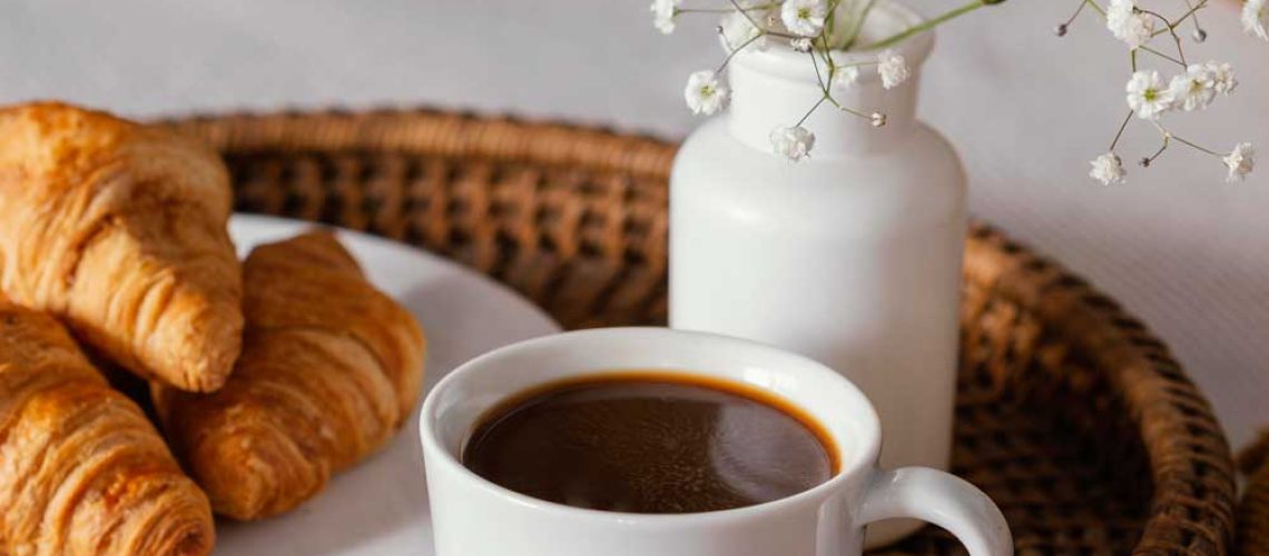 high-angle-croissants-coffee-cup