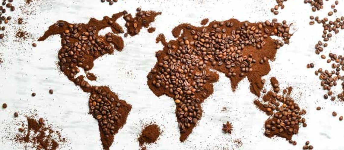 world-map-fragrant-coffee-beans-white-wooden-background-traditional-drinks-top-view